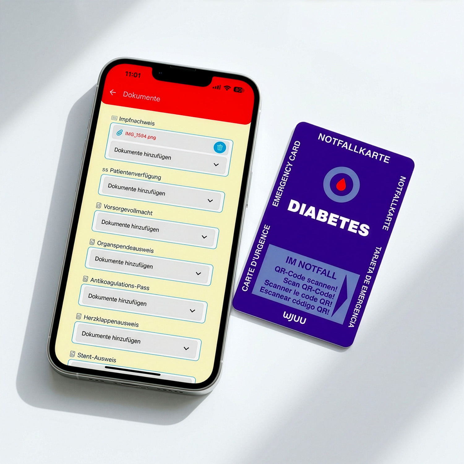 Wjuu Diabetikerausweis neben Smartphone mit digitalem Profil und Dokumenten