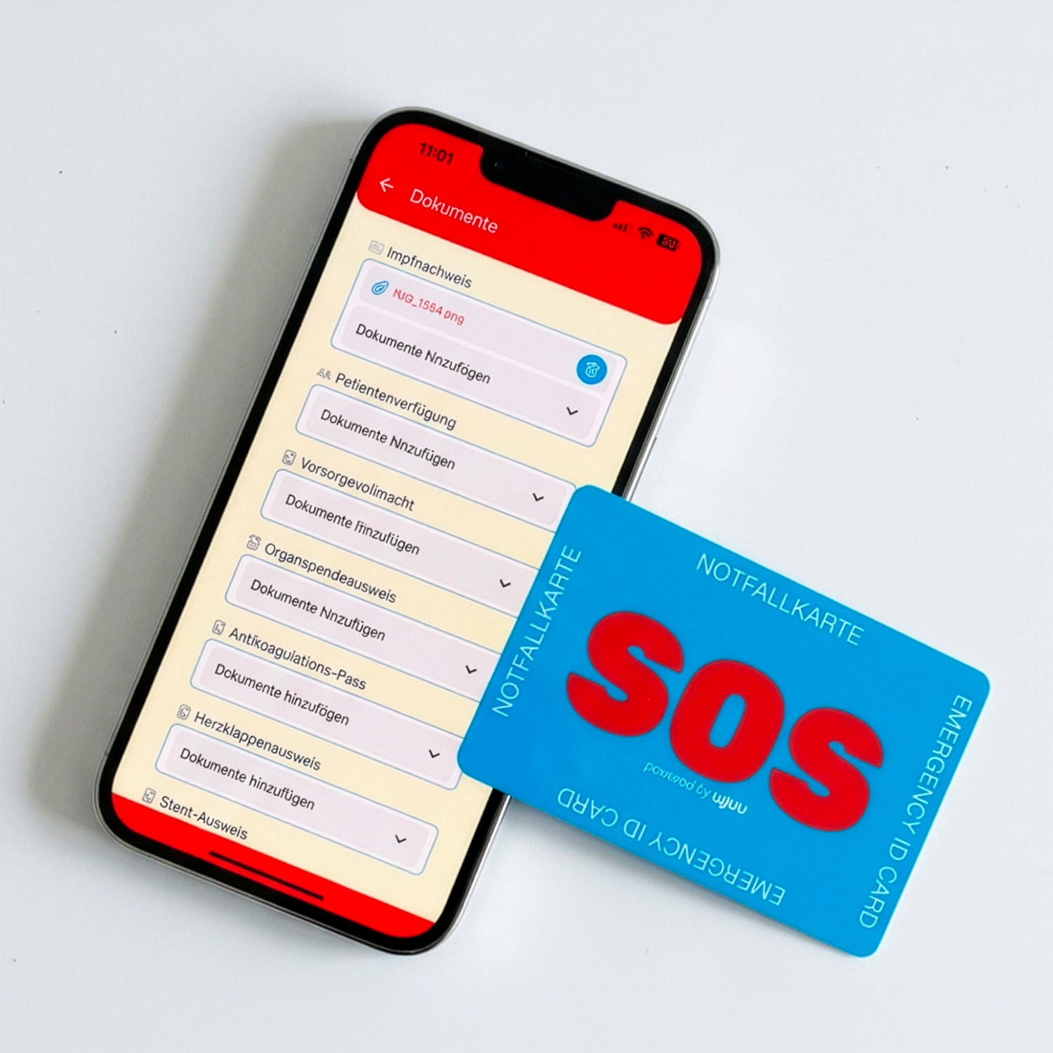 Wjuu SOS-Notfallkarte neben Smartphone mit digitalem Profil und Notfalldaten